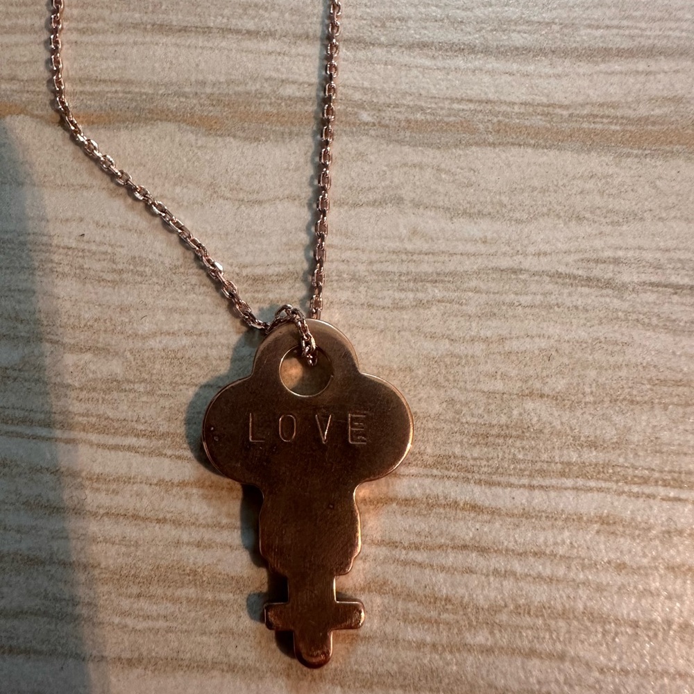The giving key Pendant Necklace with 'Love' Inscription